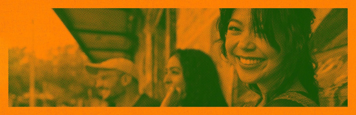Photo of Orange screen print style banner with three people leaning against a street wall.