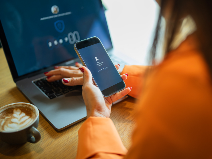 person looking at phone with authenticating verification