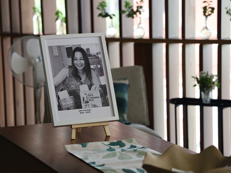 Image of photo frame on a table in a coffee shop. 