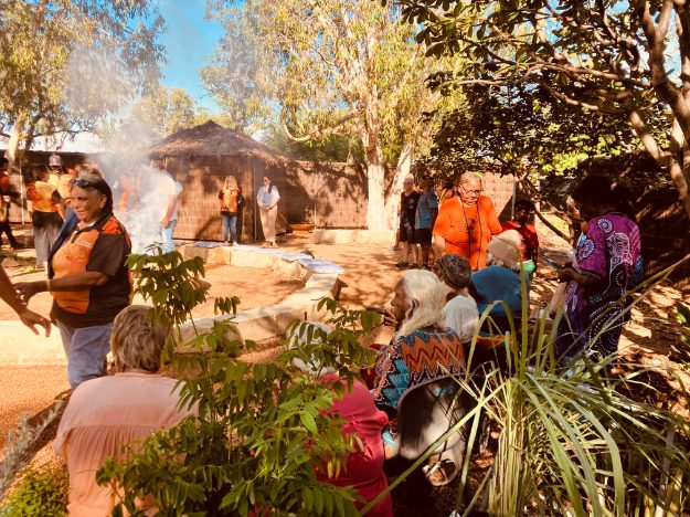 People gathered around a circle in Derby.